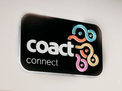 CoAct Connect illuminated sign in the Stones Corner office