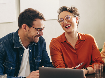 Two team members chatting together