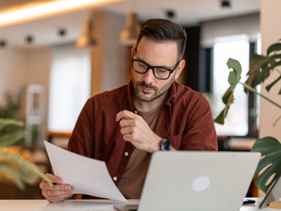 Quality Assurance staff member working on documents